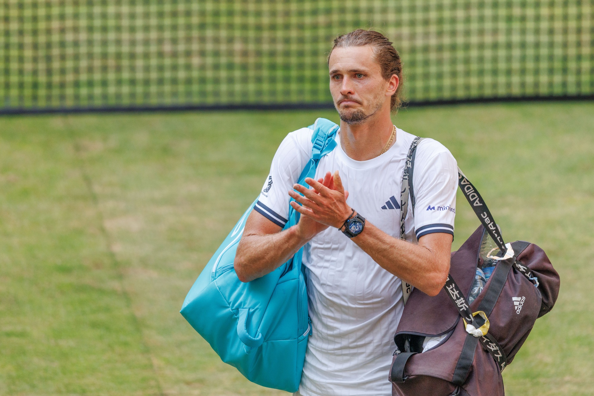 Germany's Alexander Zverev acknowledges the crowd after loosing to United States' Taylor Fritz during their semi final match at the ATP German Open tennis tournament in Halle, Germany, Saturday, June 20, 2026. Photo: Friso Gentsch/dpa via AP
