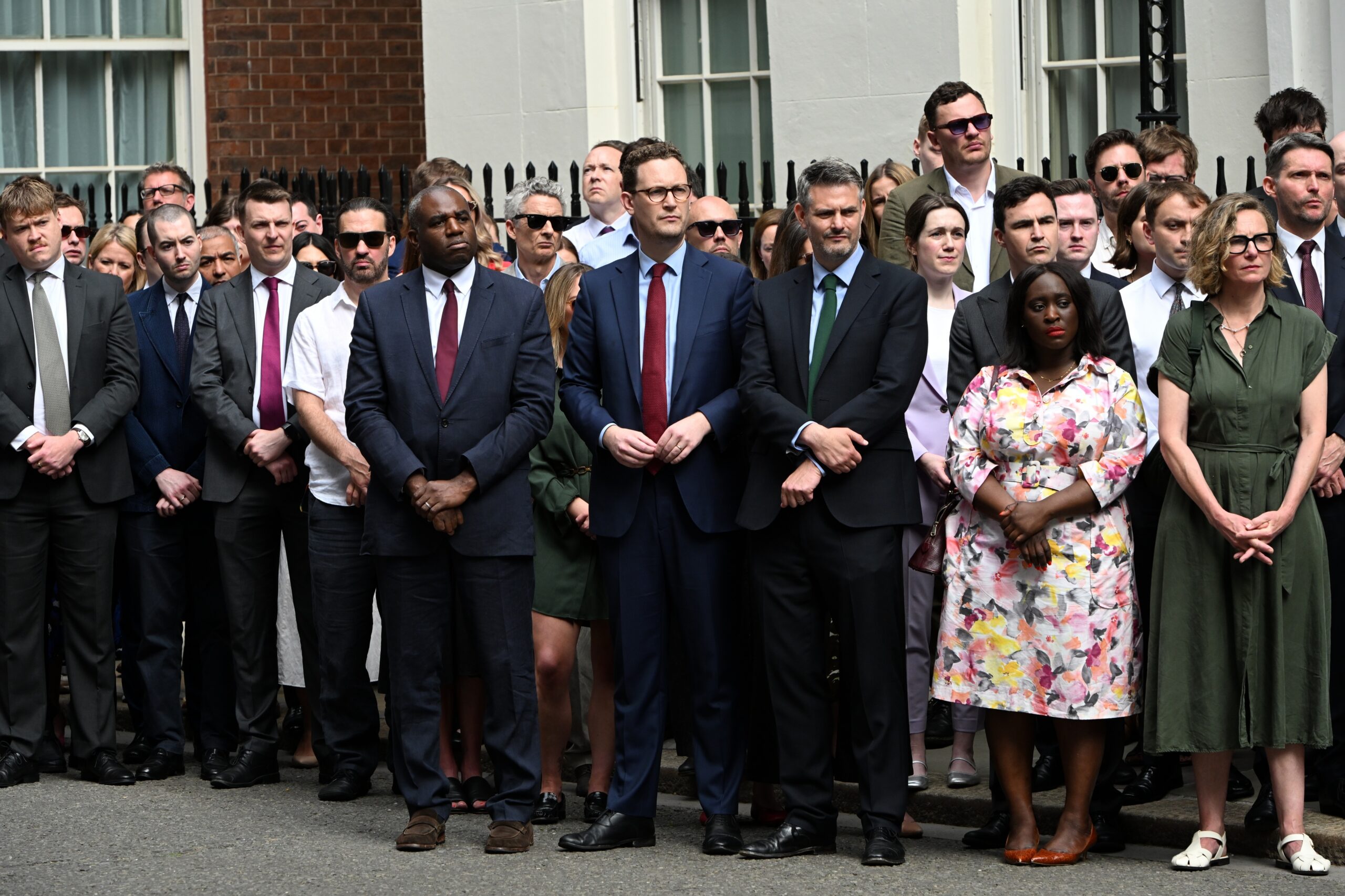 Members of the government stand outside Downing Street to listen to Britain's Prime Minister Keir Starmer resigning in London, Monday, June 22, 2026. Photo: Thomas Krych/AP