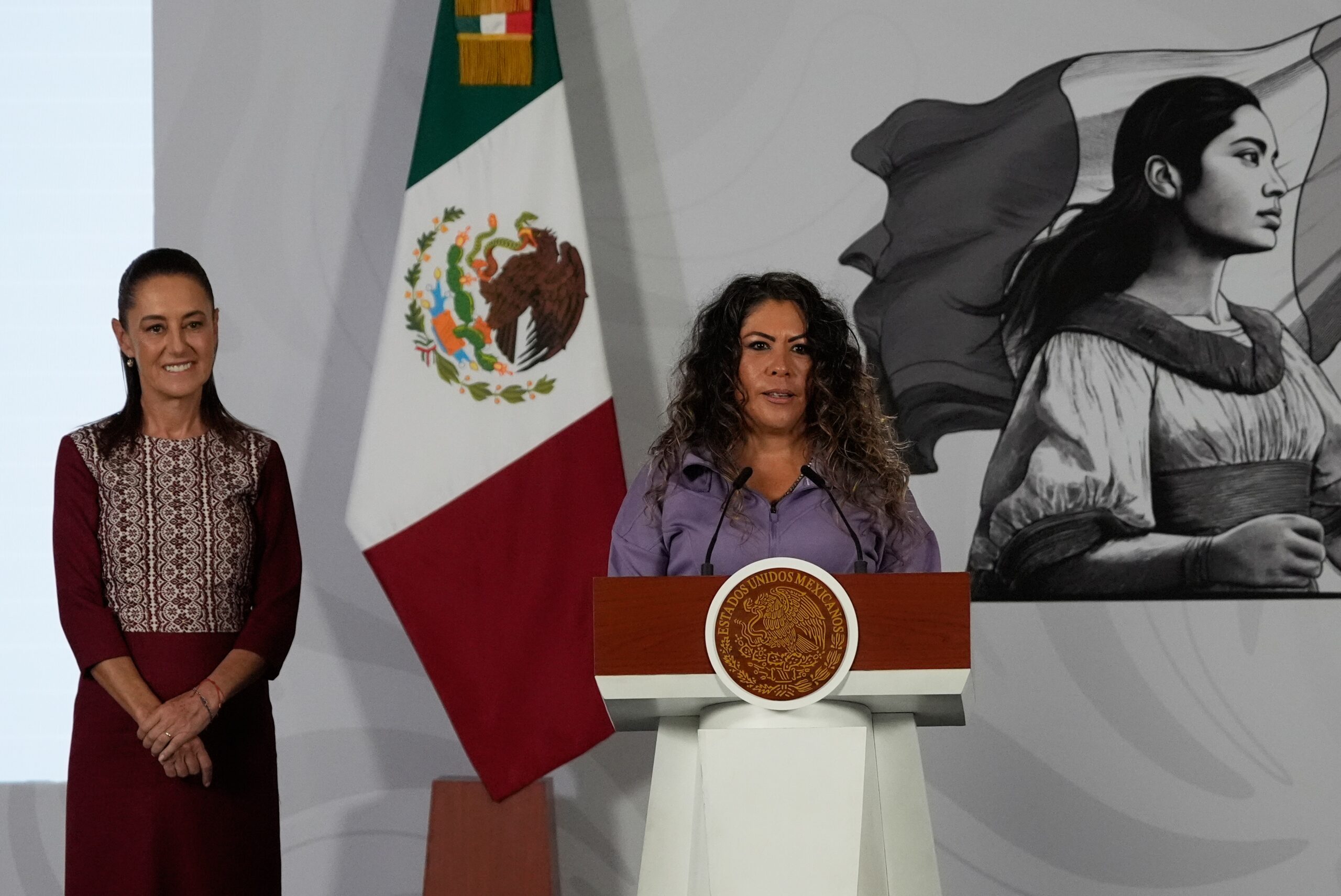 Carla Gomez, the caretaker of Merlin the duck, speaks during the daily press conference of Mexican President Claudia Sheinbaum, left, at the National Palace in Mexico City, Monday, June 22, 2026. Photo: Marco Ugarte/AP