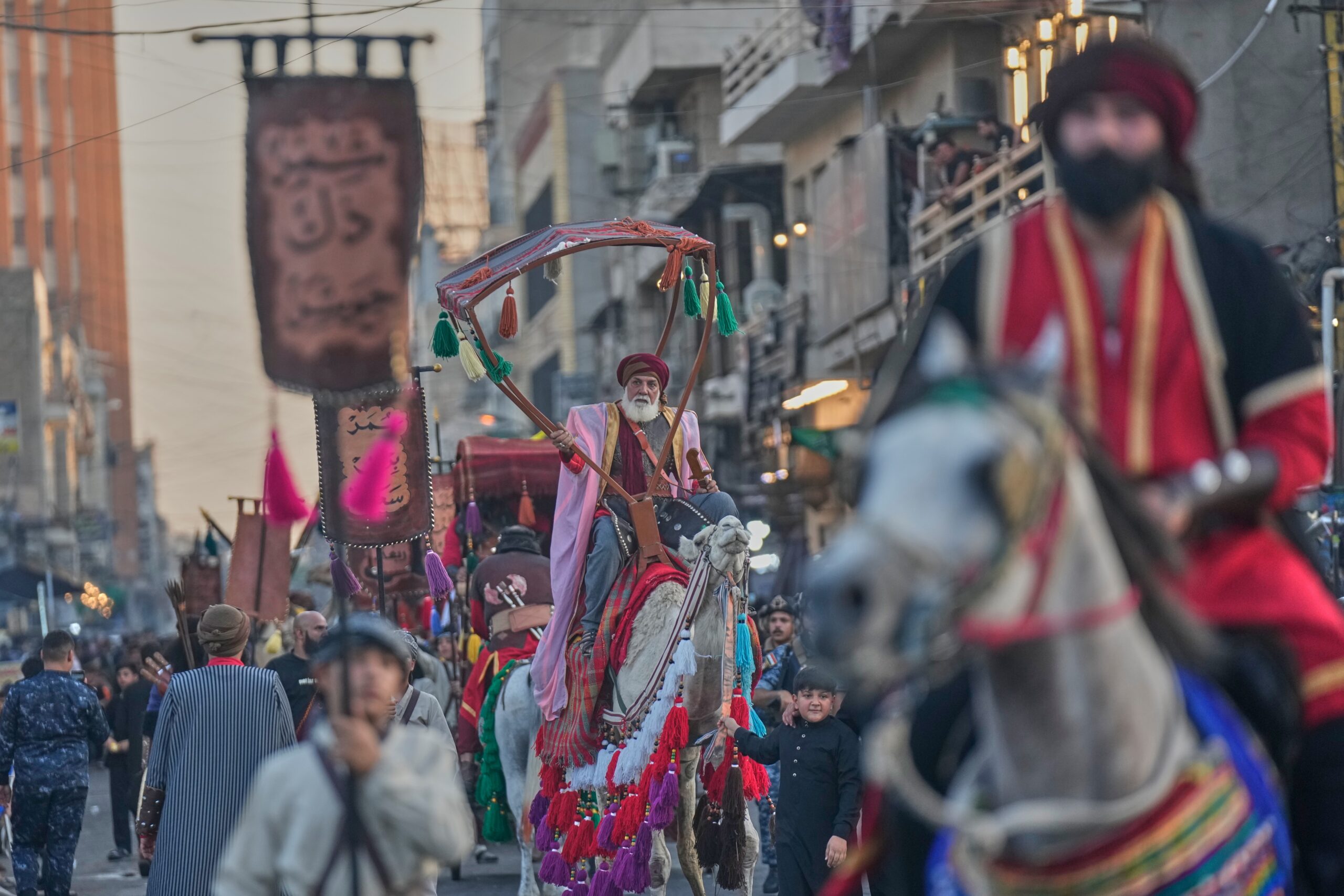 Iraqi Shiite wear traditional clothes to perform the epic of Imam Hussein, as part of the Ashura festivals in Baghdad, Iraq, Monday, June 22, 2026. Photo: Hadi Mizban/AP