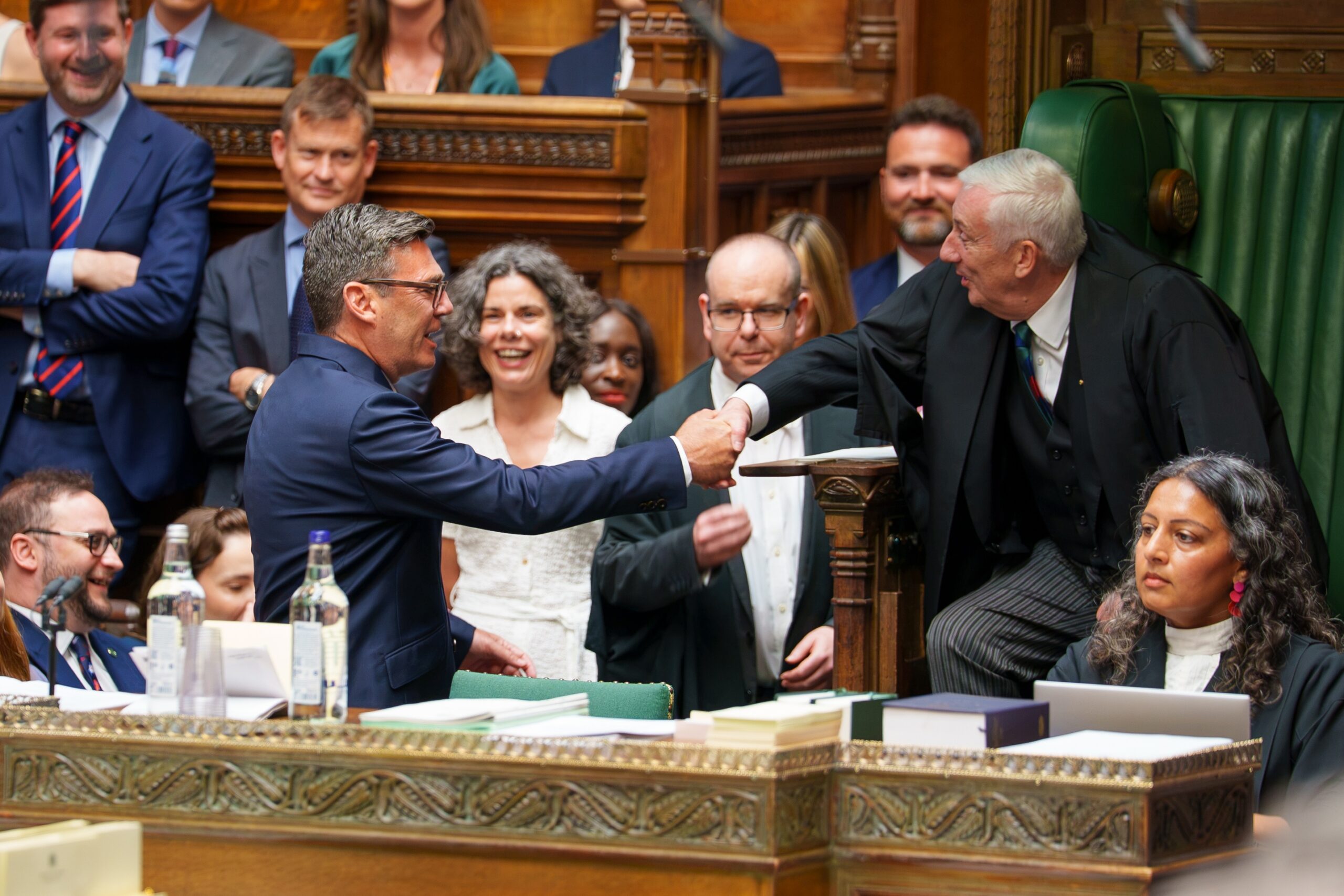 Andy Burnham, left, shakes hands after being sworn-in as an MP in the House of Common in London, England, Monday, June 22, 2026. Photo: House of Commons via AP