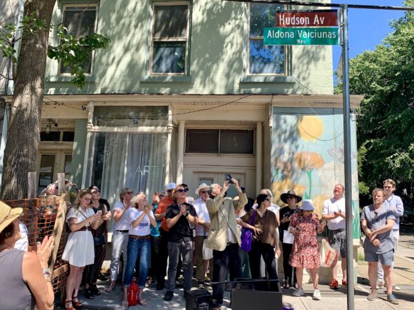 The crowd applauds the newly unveiled “Aldona Vaiciunas Way” street sign in Vinegar Hill. Photo: Mary Frost/Brooklyn Eagle
