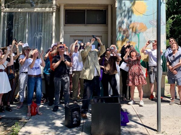The crowd takes photos of the newly unveiled “Aldona Vaiciunas Way” street sign in Vinegar Hill. Photo: Mary Frost/Brooklyn Eagle