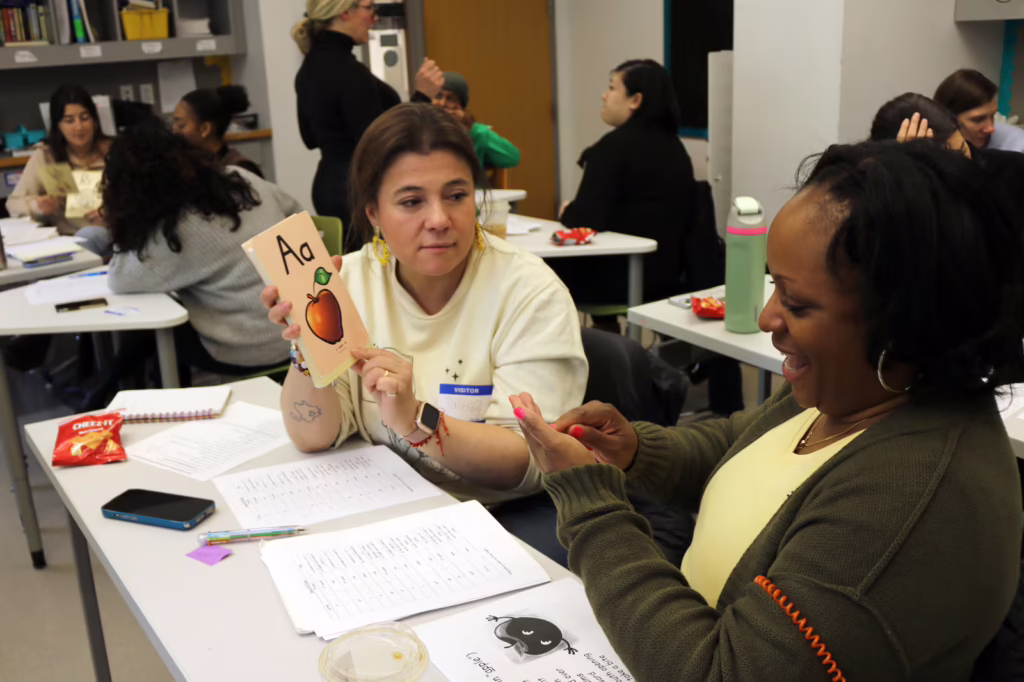 Manhattan elementary school teachers practice delivering phonics lessons. A new report found that half of New York state teacher preparation programs fail to adequately teach scientifically grounded reading instruction. (Alex Zimmerman / Chalkbeat)
