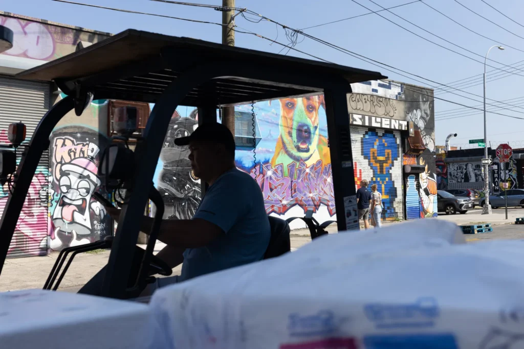 A worker drives a forklift in an industrial part of Bushwick, July 9, 2026. Credit: Ben Fractenberg/The City Reporter