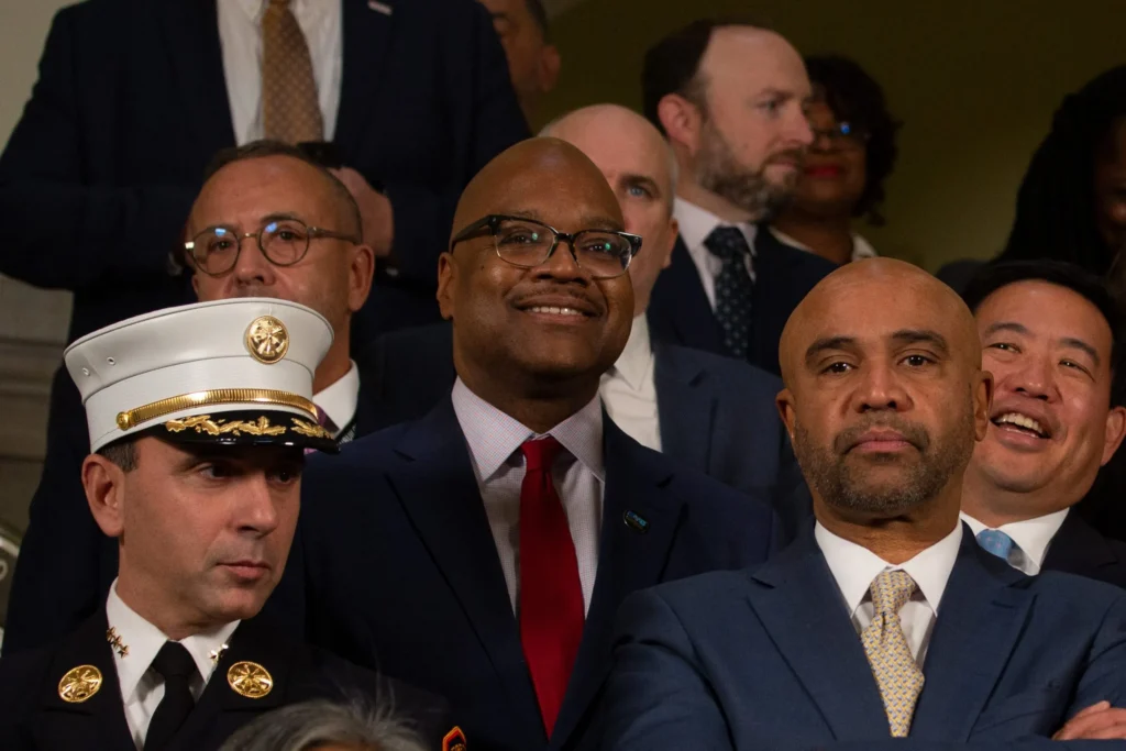 Former social services commissioner Gary Jenkins, center, attends a Mayor Eric Adams press conference at City Hall press conference on affordable housing, Dec. 8, 2023. Credit: Ben Fractenberg/THE CITY