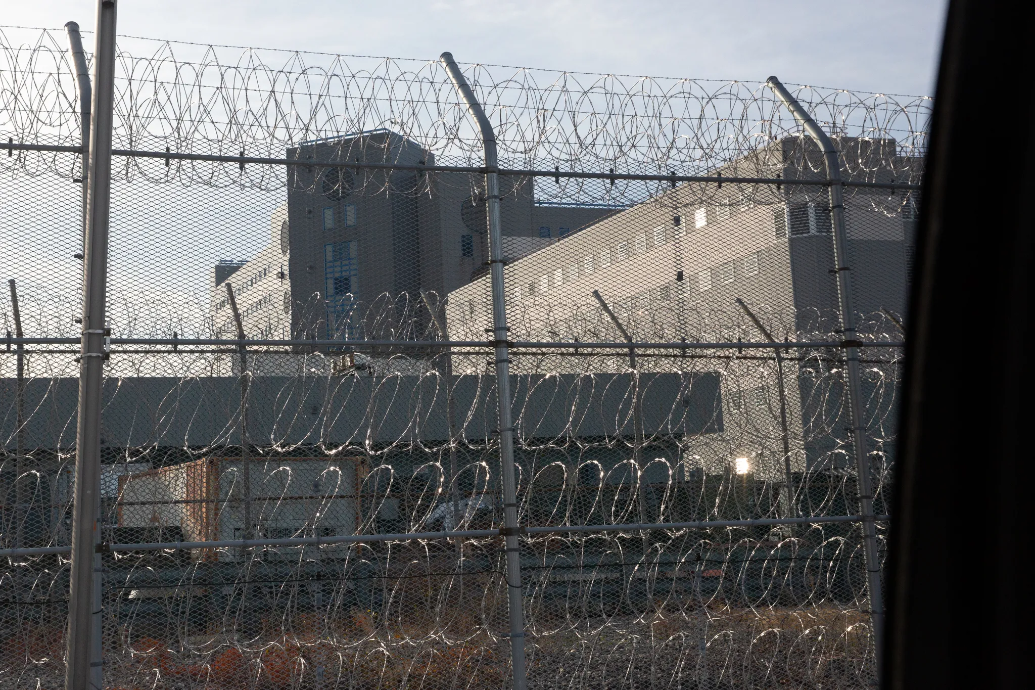 Barbed wire surrounds a jail facility on Rikers Island, Dec. 8, 2024. Credit: Ben Fractenberg/THE CITY