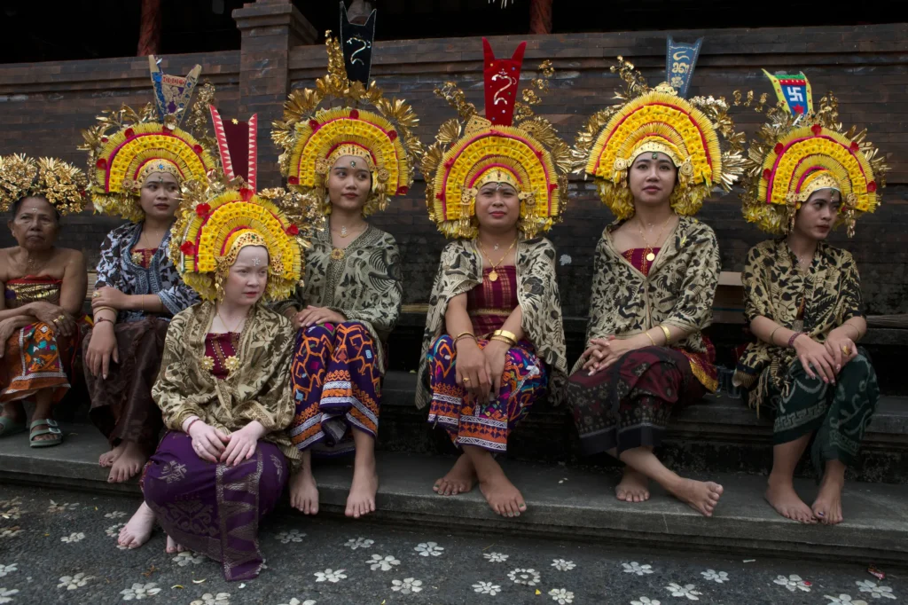 INDONESIA — Balinese Hindu ceremony marks the beginning of the Tenganan calendar year, spanning June and July, celebrating the birth of their ancestors: Women in traditional dress gather during a Balinese Hindu ritual called Usaba Kasa, a ceremony held to express gratitude to God for a bountiful harvest and the safety of their village, in Karangasem, Bali, Wednesday, July 1, 2026. Photo: Firdia Lisnawati/AP
