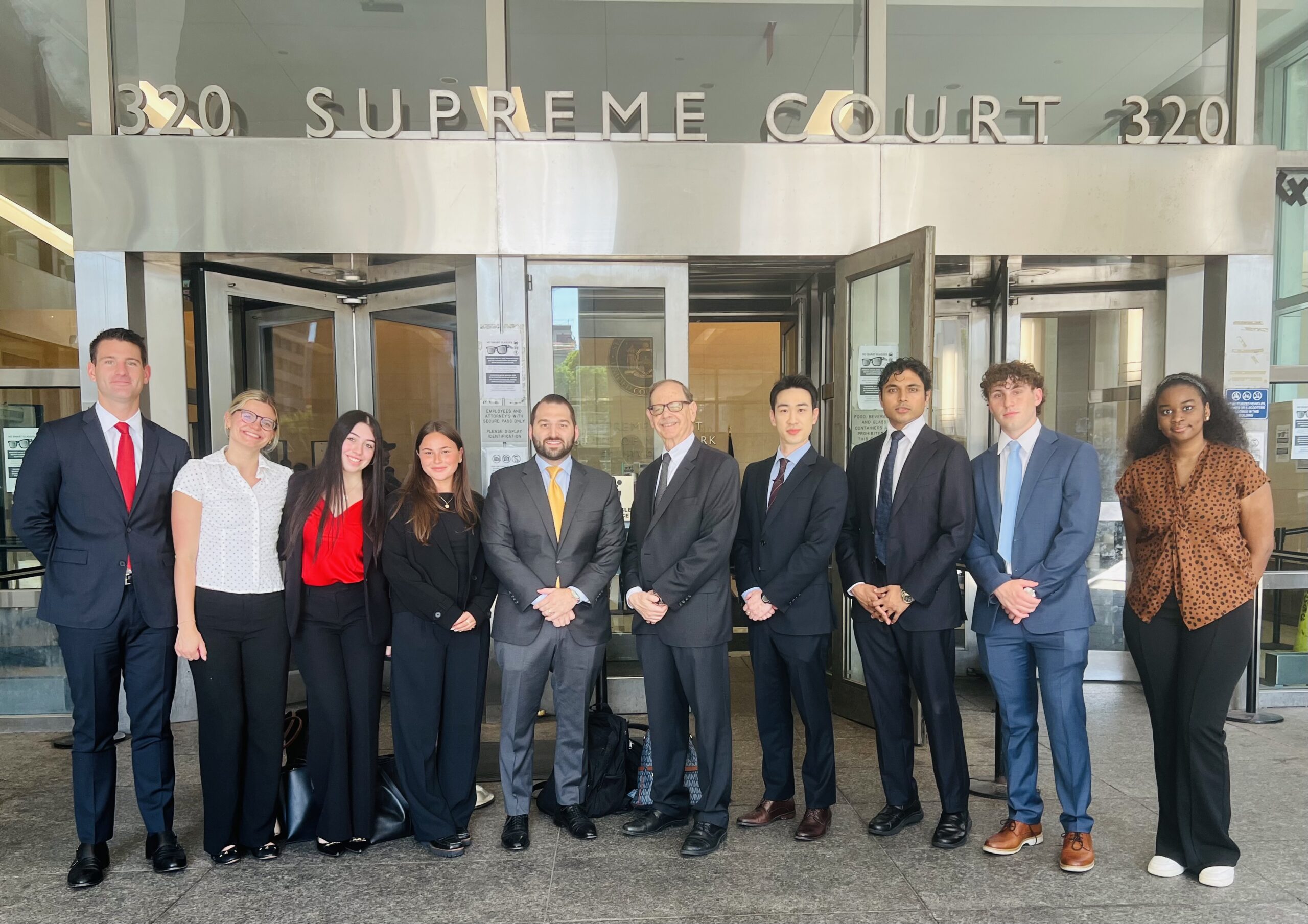 Liakas’ 2026 summer interns alongside Nick Liakas, Esq., and Hon. Mark Partnow. Photo: Wayne Daren Schneiderman/Brooklyn Eagle