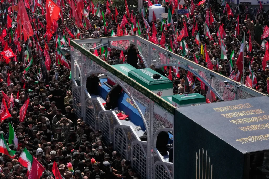 TEHRAN — The laws of unintended consequences — unified, vociferous opposition to the United States: The truck carrying the coffins of the slain Iranian Supreme Leader Ayatollah Ali Khamenei and members of his family makes its way through mourners during the funeral procession in Iran, Monday, July 6, 2026. Photo: Vahid Salemi/AP