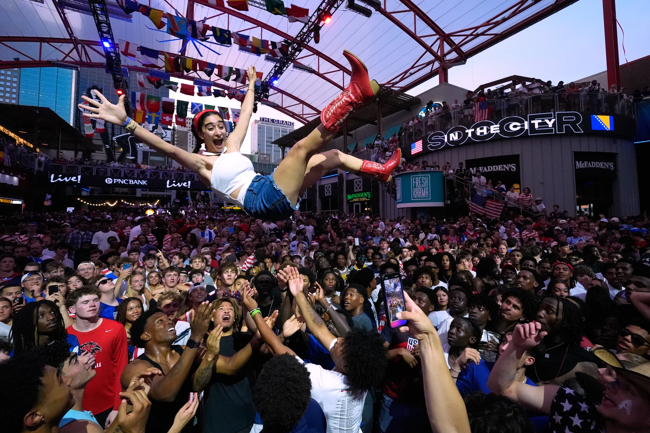 KANSAS CITY — It’s a party in the U.S.A.: Fans celebrate during a watch party for a World Cup soccer match against Bosnia at the KC Live! entertainment district, Wednesday, July 1, 2026, in Missouri. Photo: Charlie Riedel/AP