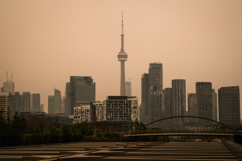 The CN Tower is pictured in Toronto as wildfire smoke fills the city, on Wednesday, July 15, 2026. Photo: Laura Proctor/The Canadian Press via AP