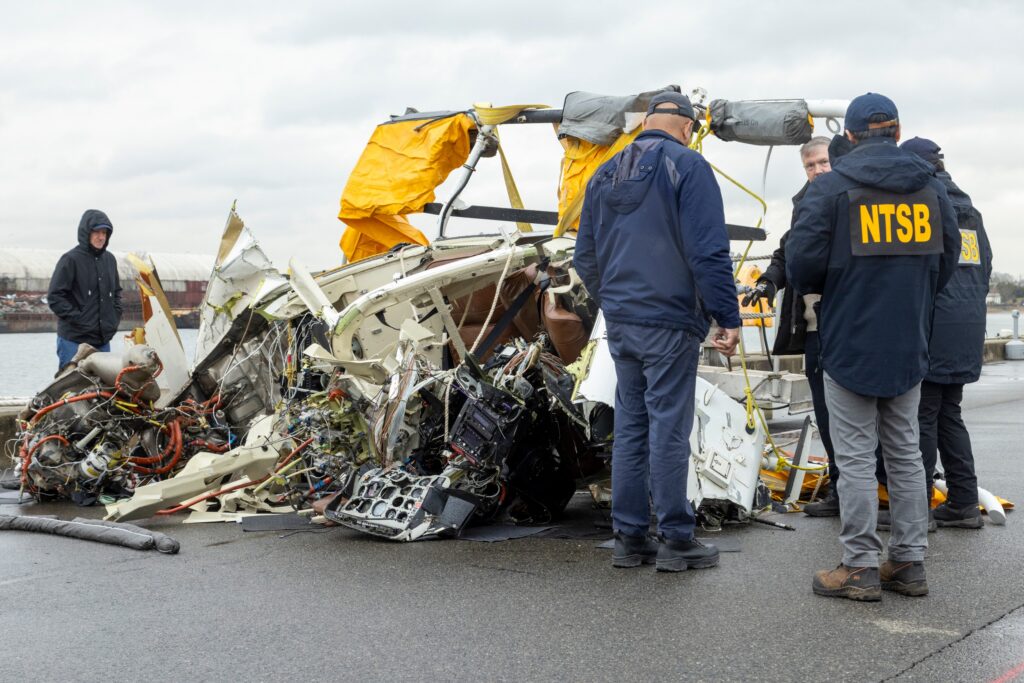 In this image released by the National Transportation Safety Board, an NTSB team surveys the wreckage Recovered from the helicopter that crashed into Hudson River, April 11, 2025, in Jersey City, N.J. Photo: NTSB via AP, File